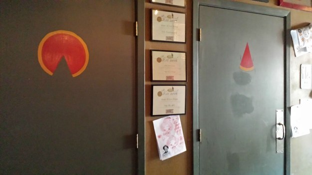 The toilet signs in this pizza place.